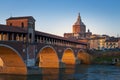 Panorama of covered bridge and Pavia cathedral at sunset Royalty Free Stock Photo