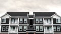 Panorama crop Small upmarket apartment block with balconies day light Royalty Free Stock Photo