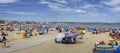 Panorama of crowded beach on a hot summers\' day in Weymouth, Dorset, UK