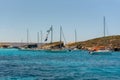 Panorama of the crystal clear blue waters of Santa Maria Beach in Santa Marija Bay, Comino, Malta