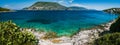 Panorama of crystal clear transparent blue turquoise teal Mediterranean seascape in Fiskardo town. Kefalonia, Ionian Royalty Free Stock Photo