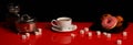 Panorama with a Cup of coffee, a donut and sugar on a red glossy table Royalty Free Stock Photo