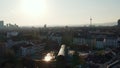 Panorama curve shot of flying over buildings in Bornheim neighbourhood. Revealing city skyline with skyscrapers against