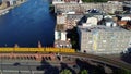 2 old yellow subway U Bahn meet on bridge. Perfect aerial view flight