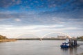 Panorama of the Danube river with the Zezeljev Most bridge in background at dusk. Zezelj bridge is a railway and road bridge Royalty Free Stock Photo