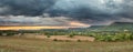 Panorama of dark clouds over plains Royalty Free Stock Photo