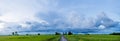 Dark sky and dramatic black cloud before the rain. rainy storm over rice field Royalty Free Stock Photo