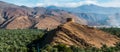 Panorama of date palms & mountains & ancient tower, Oman Royalty Free Stock Photo