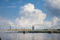 Panorama of the Daugava river in Riga, latvia, with a train from Latvian railways over dzelzcela tilts or Riga Railway Bridge with Royalty Free Stock Photo