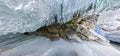 Panorama dawn in an ice cave with icicles on Baikal, Olkhon