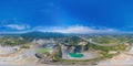 360 panorama by 180 degrees angle seamless panorama of aerial view of machine excavator trucks dig coal mining or ore in quarry in