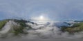 360 panorama by 180 degrees angle seamless panorama of aerial view of sunrise above fluffy sea fog misty clouds with mountain hill