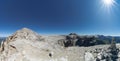 Panorama Dolomites mountain landscape near Passo Sella with many climbers heading to the summit