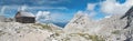 Panorama of Dom Valentina Stanica mountain hut with Rjavina mountain in Julian Alps