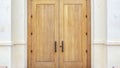 Panorama Double arched wooden entrance door of exterior
