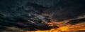 Panorama of a Dramatic sky at stormy sunset. Dark clouds before a thunder storm Royalty Free Stock Photo