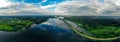 Panorama from a drone of a blue river and green forest in russia