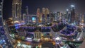 Panorama of Dubai Marina with several boat and yachts parked in harbor and skyscrapers around canal aerial night Royalty Free Stock Photo