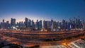 Panorama of Dubai Marina skyscrapers and Sheikh Zayed road with metro railway aerial day to night timelapse, United Arab Royalty Free Stock Photo