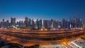 Panorama of Dubai Marina skyscrapers and Sheikh Zayed road with metro railway aerial day to night timelapse, United Arab Royalty Free Stock Photo