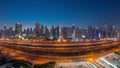 Panorama of Dubai Marina skyscrapers and Sheikh Zayed road with metro railway aerial day to night timelapse, United Arab Royalty Free Stock Photo