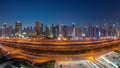 Panorama of Dubai Marina skyscrapers and Sheikh Zayed road with metro railway aerial day to night , United Arab Emirates Royalty Free Stock Photo