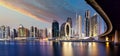 Panorama of Dubai skyline from canal Creek at sunrise and night, UAE Royalty Free Stock Photo
