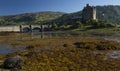 A panorama of the Eilean Donan Castle on a sunny afternoon in Scotland
