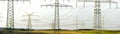 Panorama of electric power poles Royalty Free Stock Photo