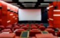 Panorama of an empty cinema hall as creative abstract blur background Royalty Free Stock Photo