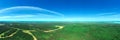 Panorama of the endless forest on bright sunny day. View from above