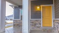 Panorama Entryway of a home with stairs going up to the front porch and door