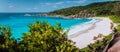 Panorama of epic Grand Anse Beach in La Digue island, Seychelles. White sand beach, big ocean waves and unique granite Royalty Free Stock Photo