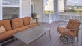 Panorama Exterior view of a home with seating area on the wooden deck