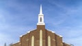 Panorama Exterior view of a magnificent church with cloudy blue sky background Royalty Free Stock Photo