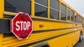 Panorama Exterior view of a yellow school bus with a red stop sign and signal lights