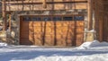 Panorama Facade of a luxury wooden home in Park City Utah with snowy driveway in winter Royalty Free Stock Photo