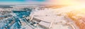 panorama Factory Bird's-eye View At Sunny Snowy Winter Day. Plant Pipe With Escaping Steam Or Smoke. Aerial View Top