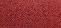 Factory fabric of red color . Close-up long and wide texture of natural red fabric. Fabric texture of natural cotton or linen text Royalty Free Stock Photo