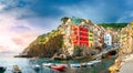 Panorama of the famous Italian seaside viilage Riomaggiore at sunset Royalty Free Stock Photo