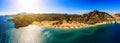 Panorama of the famous resort beach tsampika with rows of sunbeds and umbrellas, view of the mountains, the island from Royalty Free Stock Photo