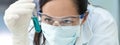 Panorama Female Laboratory Scientist or Doctor Wearing Face Mask in Lab With Test Tube Royalty Free Stock Photo