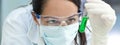 Panorama Female Laboratory Scientist or Doctor Wearing Face Mask in Lab With Test Tube Royalty Free Stock Photo