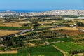 Panorama with field, Mosta town and sea. Royalty Free Stock Photo