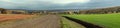 Panorama of fields, road and forest in autumn