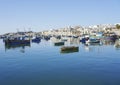 Panorama of fishing boats in european Marsaxlokk town in Malta