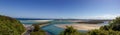 panorama of flat sand dunes at delta of Nambucca river entering Pacific ocean through wide sandy beach of Australian coast around Royalty Free Stock Photo