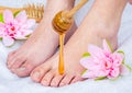 Panorama of a foot honey massage