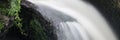 Panorama format landscape of waterfall in forest Royalty Free Stock Photo