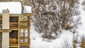 Panorama frame Balconies and chimney of homes against mountain covered with snow in winter